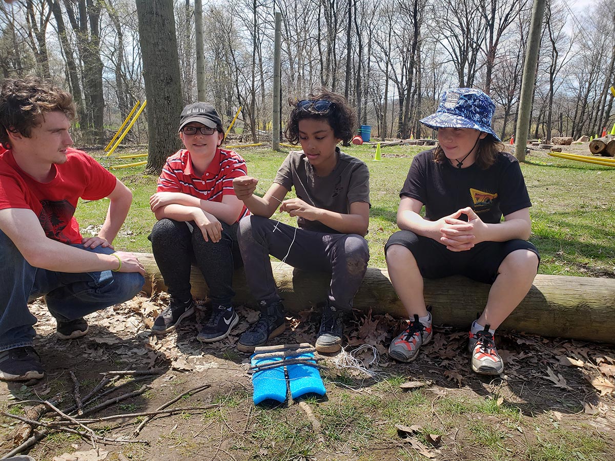 Students build a campfire